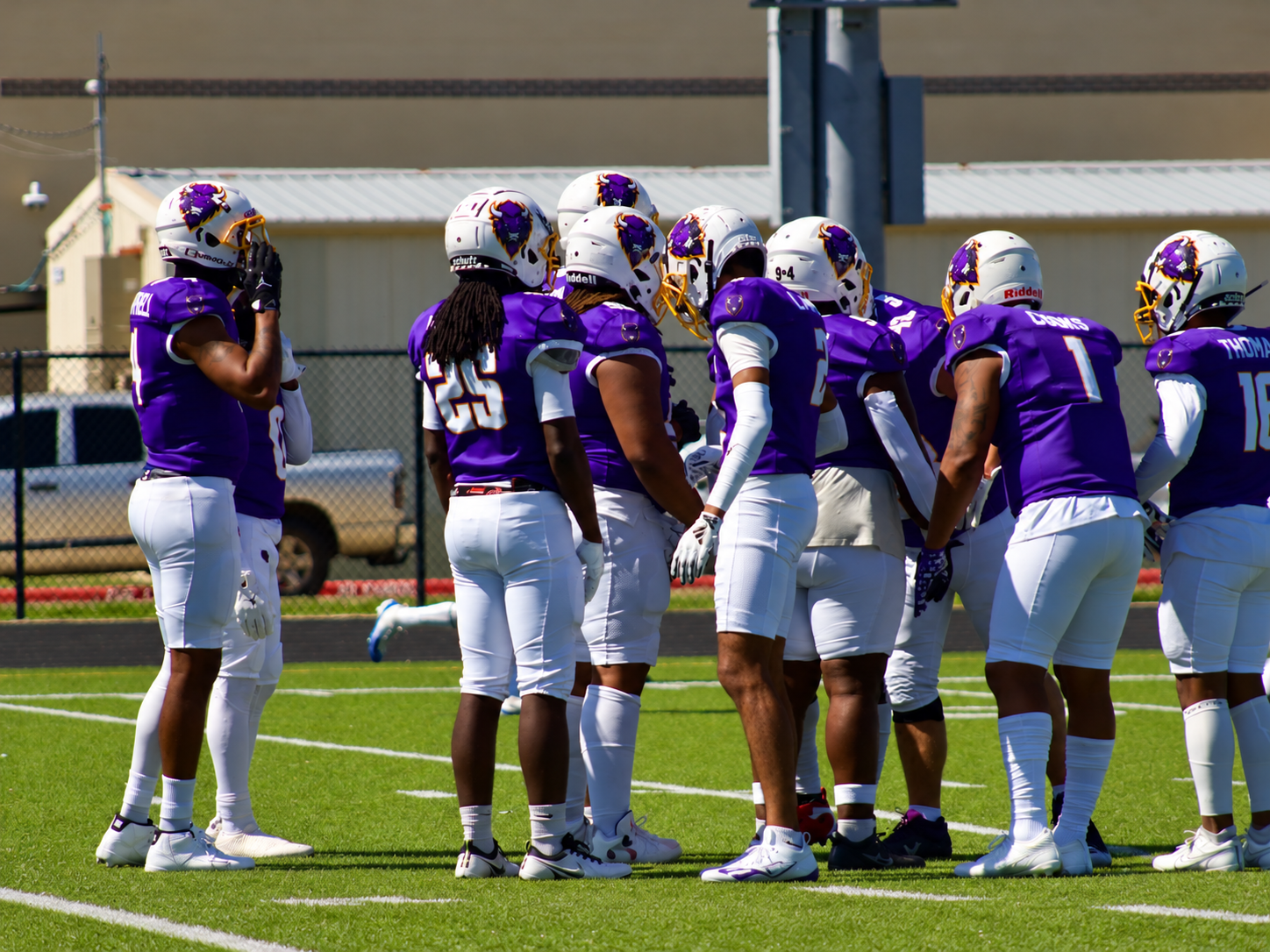 Bison defensive players gathered before a game