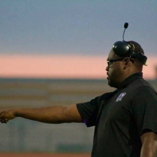 Head Coach Louis Brown coaching on the sideline